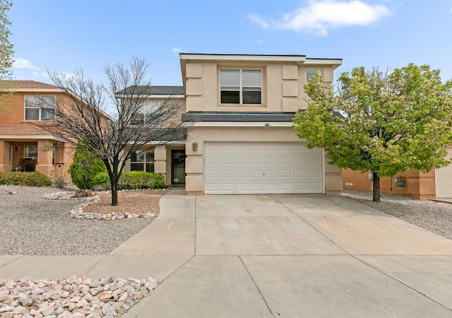 7419 Tolleson Ave NW, Albuquerque, NM 87114 - traditional home featuring an attached garage, stucco siding, and driveway