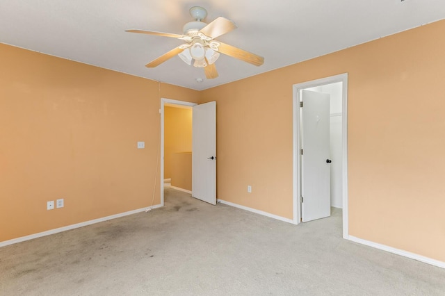 7419 Tolleson Ave NW, Albuquerque, NM 87114 - unfurnished bedroom with baseboards, carpet flooring, a walk in closet, and ceiling fan