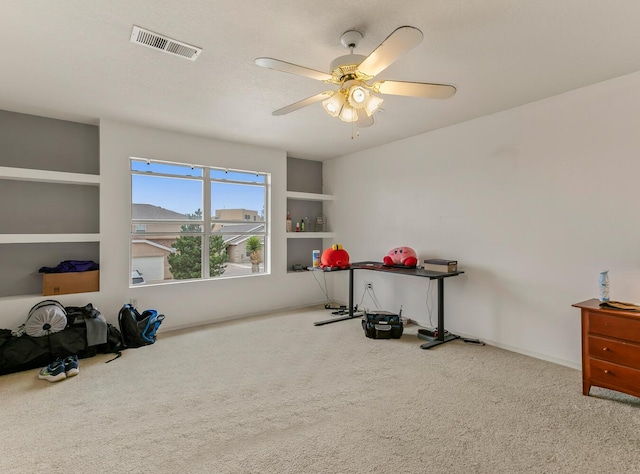 7419 Tolleson Ave NW, Albuquerque, NM 87114 - interior space with visible vents, carpet flooring, built in shelves, and ceiling fan