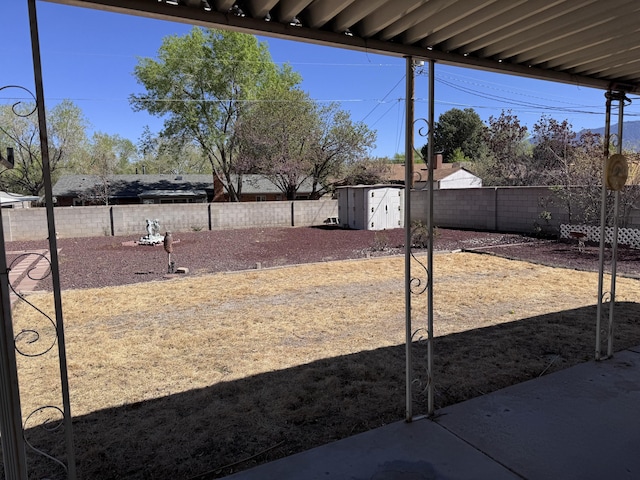 6329 Prairie Rd NE, Albuquerque, NM 87109 - view of yard featuring a storage shed, an outdoor structure, and a fenced backyard