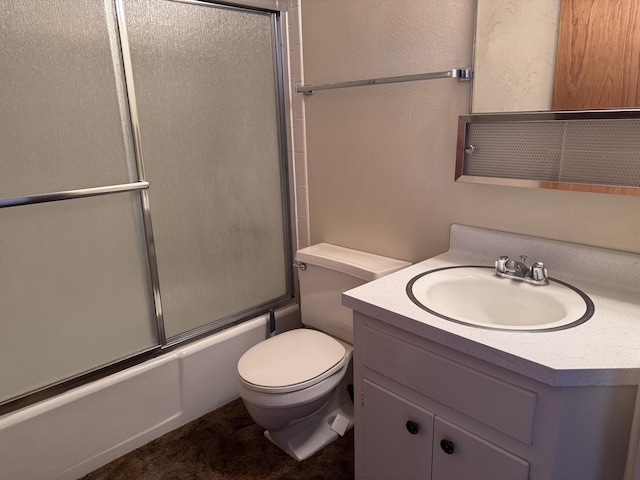 6329 Prairie Rd NE, Albuquerque, NM 87109 - full bath featuring toilet, a textured wall, combined bath / shower with glass door, and vanity