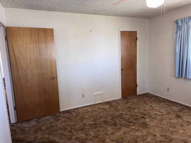 6329 Prairie Rd NE, Albuquerque, NM 87109 - unfurnished bedroom with carpet flooring, a textured ceiling, and baseboards