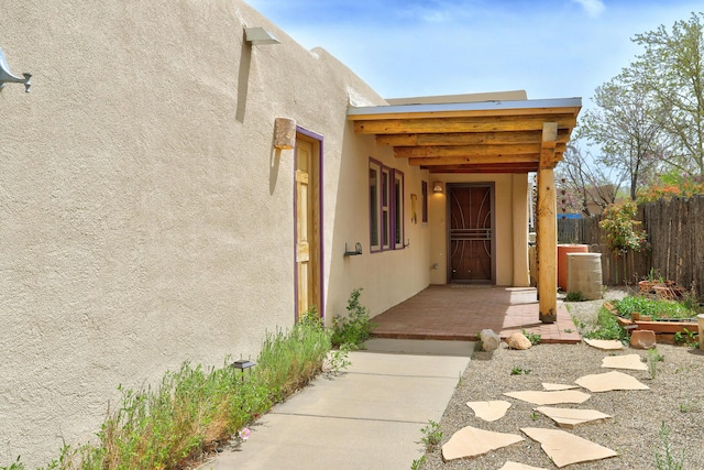 705 Lakeview Cir SE, Rio Rancho, NM 87124 - entrance to property with fence and stucco siding