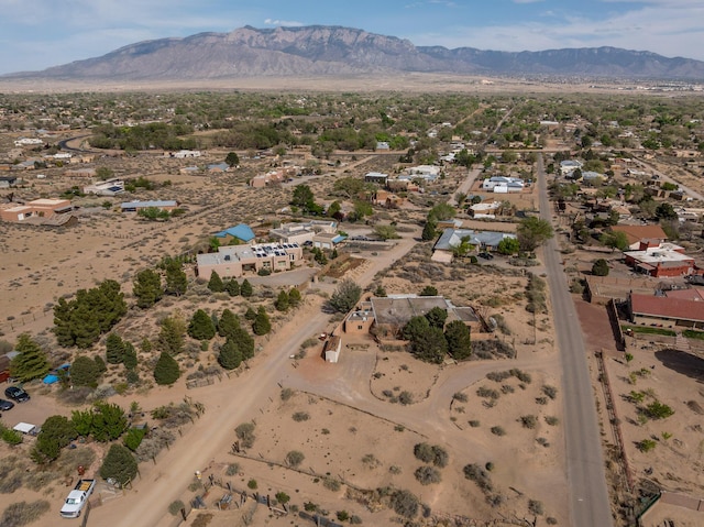 aerial view of property's location with a mountain backdrop and a desert landscape