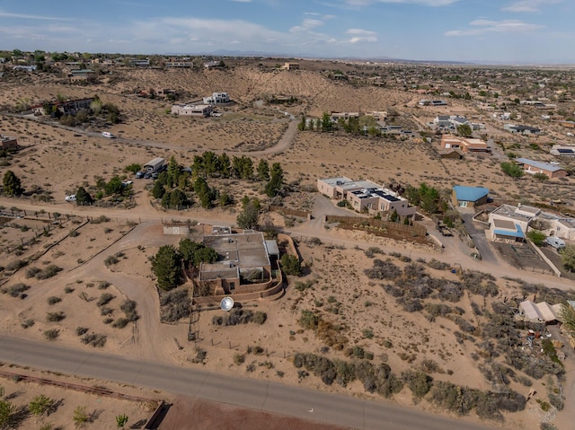 aerial overview of property's location featuring a desert landscape and rural landscape