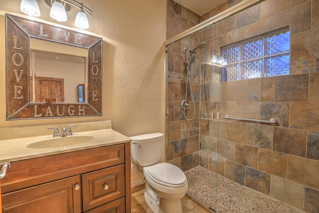 255 Diamond Tail Rd, Placitas, NM 87043 - full bath featuring a textured wall, a shower stall, and vanity