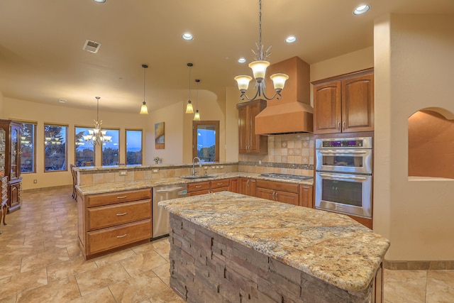 255 Diamond Tail Rd, Placitas, NM 87043 - kitchen featuring a chandelier, stainless steel appliances, light stone counters, backsplash, and a peninsula