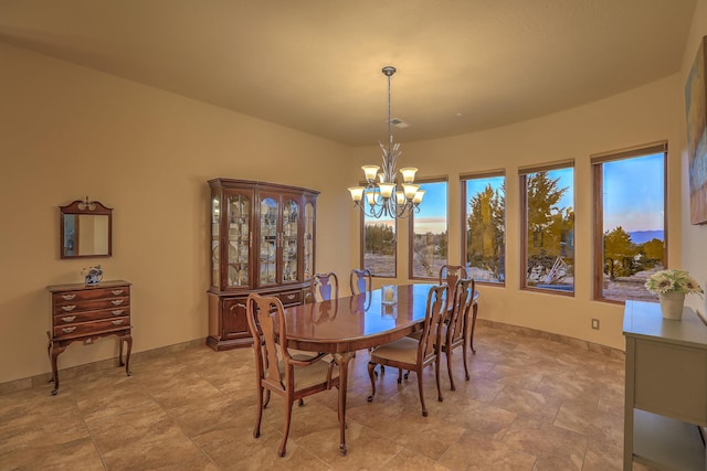 255 Diamond Tail Rd, Placitas, NM 87043 - dining space featuring a chandelier and baseboards