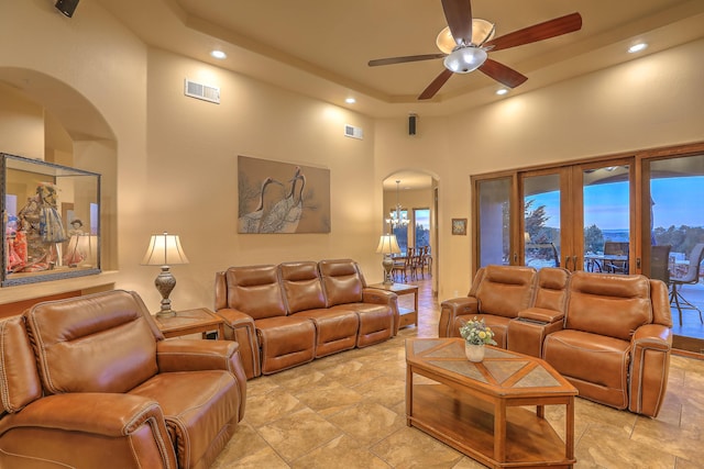 255 Diamond Tail Rd, Placitas, NM 87043 - living room with arched walkways, a high ceiling, recessed lighting, a ceiling fan, and french doors