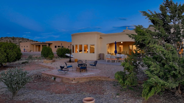 255 Diamond Tail Rd, Placitas, NM 87043 - rear view of house with a patio area and stucco siding