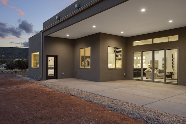 262 Diamond Tail Rd, Placitas, NM 87043 - back of house with a patio and stucco siding