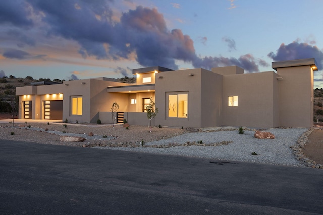 262 Diamond Tail Rd, Placitas, NM 87043 - view of front of property featuring a garage and stucco siding