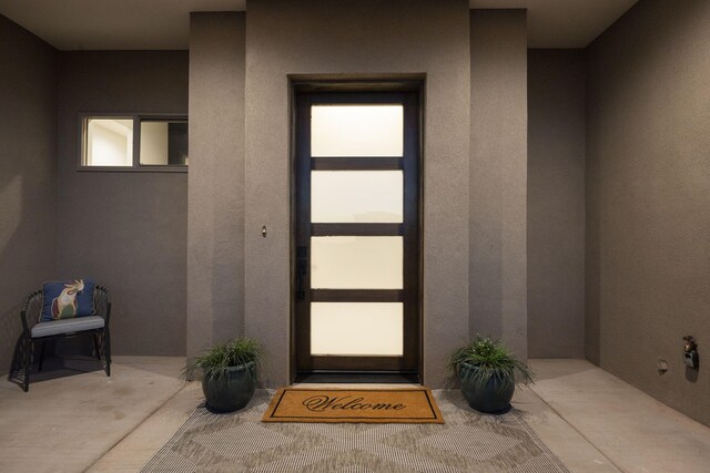262 Diamond Tail Rd, Placitas, NM 87043 - doorway to property featuring stucco siding
