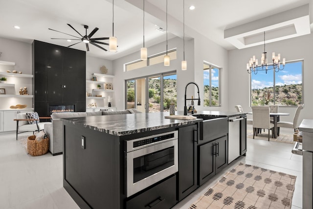 262 Diamond Tail Rd, Placitas, NM 87043 - kitchen featuring dark cabinets, plenty of natural light, a sink, and stainless steel appliances