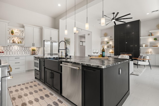 262 Diamond Tail Rd, Placitas, NM 87043 - kitchen featuring a ceiling fan, open shelves, stainless steel dishwasher, dark cabinets, and white cabinetry