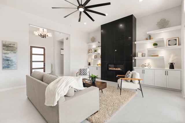 262 Diamond Tail Rd, Placitas, NM 87043 - living area with recessed lighting, baseboards, a large fireplace, and ceiling fan with notable chandelier