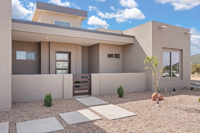 262 Diamond Tail Rd, Placitas, NM 87043 - exterior space with fence, a gate, and stucco siding
