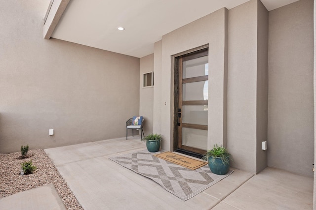 262 Diamond Tail Rd, Placitas, NM 87043 - doorway to property with a patio and stucco siding
