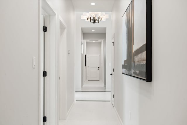 262 Diamond Tail Rd, Placitas, NM 87043 - hallway featuring baseboards, tile patterned flooring, recessed lighting, and a notable chandelier
