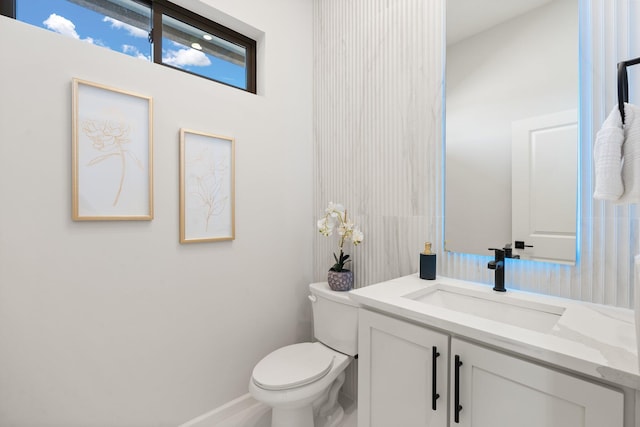 262 Diamond Tail Rd, Placitas, NM 87043 - bathroom with toilet, baseboards, and vanity