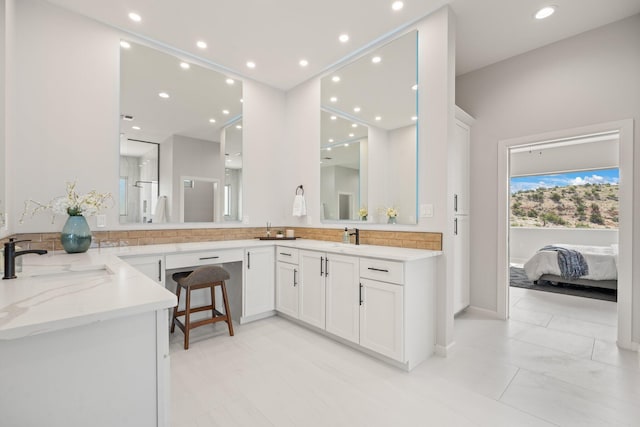 262 Diamond Tail Rd, Placitas, NM 87043 - full bath featuring vanity, baseboards, recessed lighting, and connected bathroom