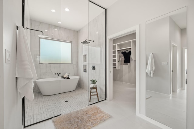 262 Diamond Tail Rd, Placitas, NM 87043 - bathroom featuring a walk in closet, tile patterned flooring, a walk in shower, a soaking tub, and recessed lighting