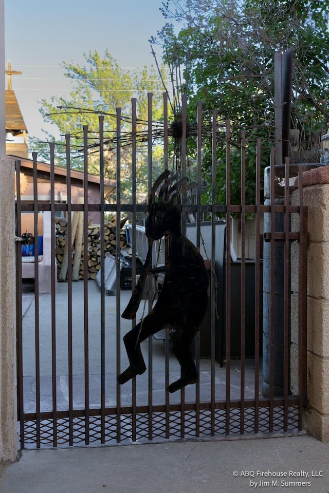 view of gate featuring fence