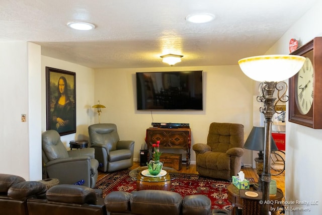 living room with wood finished floors and recessed lighting