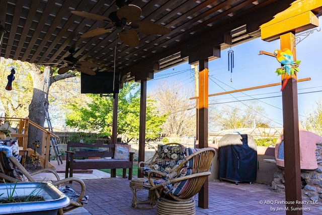 view of patio / terrace with fence, area for grilling, and a ceiling fan