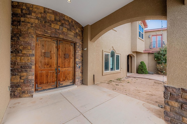 5016 Frontier Rd NE, Rio Rancho, NM 87144 - property entrance featuring a patio, french doors, and stucco siding