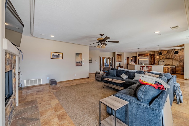 5016 Frontier Rd NE, Rio Rancho, NM 87144 - living area with recessed lighting, a ceiling fan, visible vents, and a fireplace