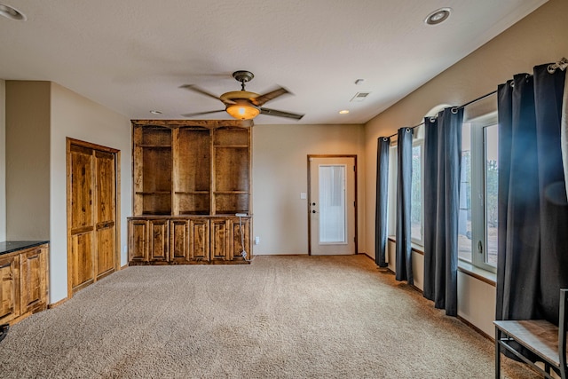 5016 Frontier Rd NE, Rio Rancho, NM 87144 - unfurnished living room featuring recessed lighting, carpet, visible vents, a textured ceiling, and ceiling fan
