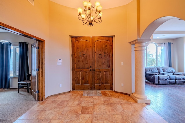 5016 Frontier Rd NE, Rio Rancho, NM 87144 - entryway with baseboards, decorative columns, a high ceiling, and arched walkways
