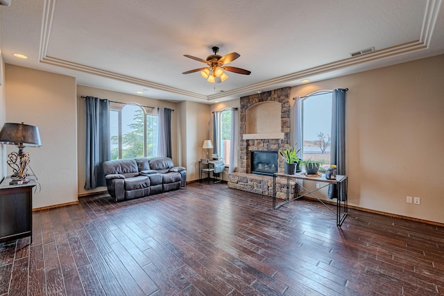 5016 Frontier Rd NE, Rio Rancho, NM 87144 - living room featuring a stone fireplace, a ceiling fan, hardwood / wood-style floors, and a raised ceiling