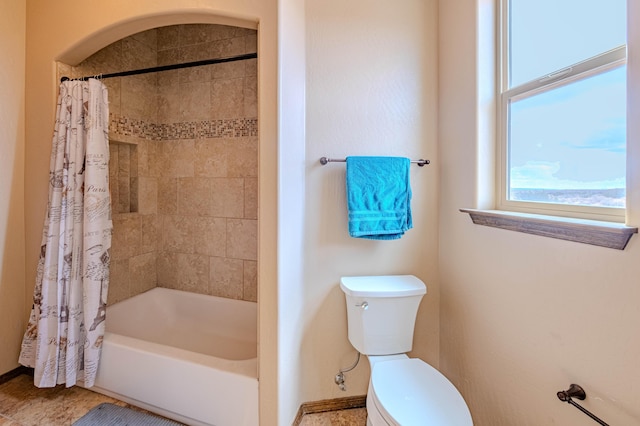 5016 Frontier Rd NE, Rio Rancho, NM 87144 - bathroom with shower / bath combination with curtain, baseboards, and toilet