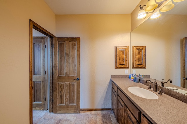 5016 Frontier Rd NE, Rio Rancho, NM 87144 - bathroom with baseboards and vanity