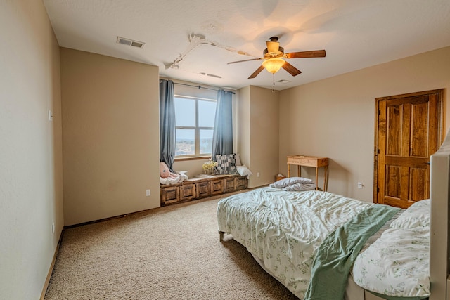 5016 Frontier Rd NE, Rio Rancho, NM 87144 - carpeted bedroom with visible vents, a ceiling fan, and baseboards