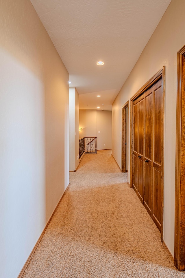 5016 Frontier Rd NE, Rio Rancho, NM 87144 - corridor with light carpet, baseboards, recessed lighting, and an upstairs landing