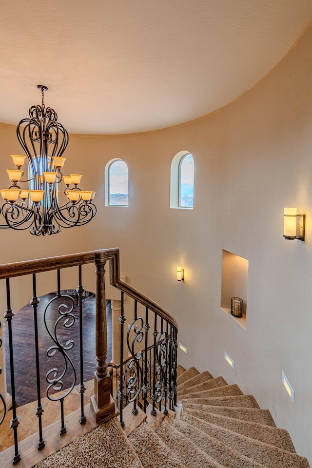5016 Frontier Rd NE, Rio Rancho, NM 87144 - staircase featuring an inviting chandelier and wood finished floors