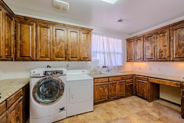 5016 Frontier Rd NE, Rio Rancho, NM 87144 - laundry area with visible vents, a sink, stone finish flooring, washer and dryer, and cabinet space