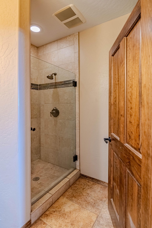 5016 Frontier Rd NE, Rio Rancho, NM 87144 - full bath featuring a shower stall, baseboards, and visible vents