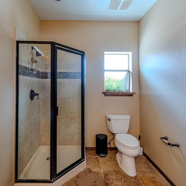 5016 Frontier Rd NE, Rio Rancho, NM 87144 - bathroom with toilet, baseboards, visible vents, tile patterned flooring, and a shower stall