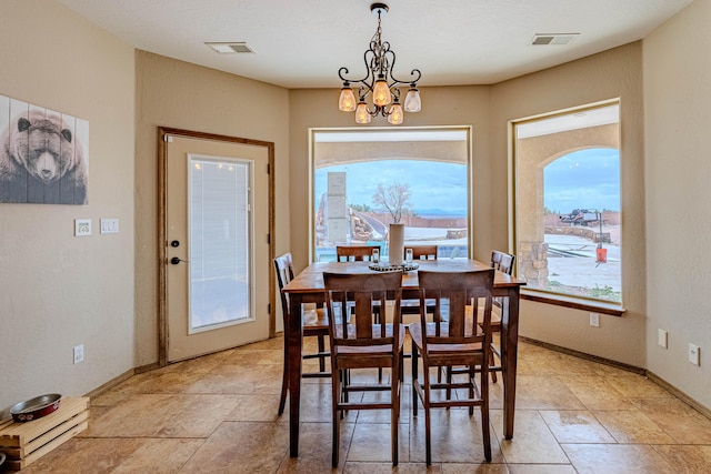 5016 Frontier Rd NE, Rio Rancho, NM 87144 - dining room featuring visible vents, baseboards, and an inviting chandelier