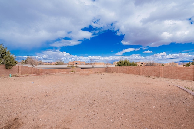 5016 Frontier Rd NE, Rio Rancho, NM 87144 - view of yard featuring a fenced backyard
