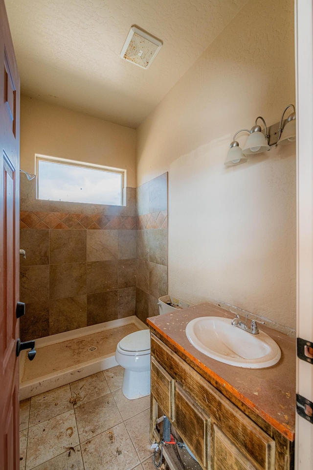 5016 Frontier Rd NE, Rio Rancho, NM 87144 - full bathroom featuring a shower stall, toilet, tile patterned flooring, and vanity