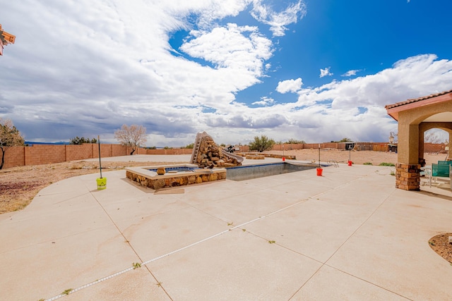 5016 Frontier Rd NE, Rio Rancho, NM 87144 - view of patio / terrace featuring a fenced backyard and an in ground hot tub
