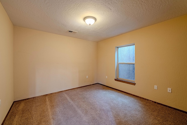 5016 Frontier Rd NE, Rio Rancho, NM 87144 - carpeted empty room with visible vents and a textured ceiling