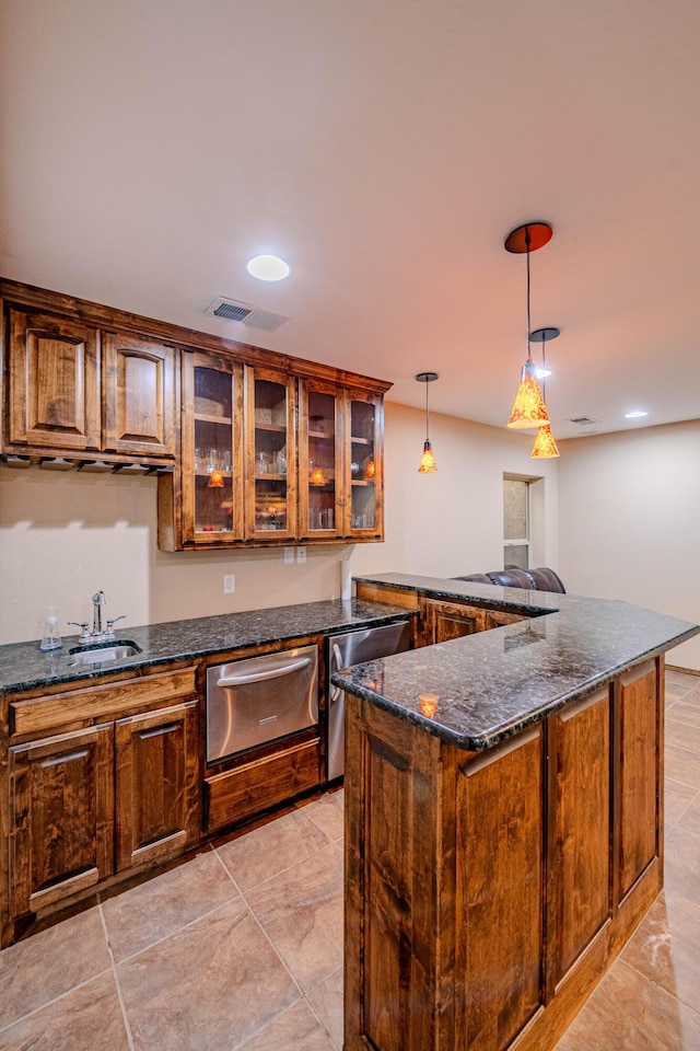 5016 Frontier Rd NE, Rio Rancho, NM 87144 - kitchen with a sink, a warming drawer, visible vents, glass insert cabinets, and pendant lighting