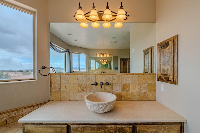 5016 Frontier Rd NE, Rio Rancho, NM 87144 - bathroom with tasteful backsplash and vanity