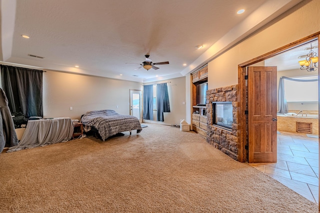 5016 Frontier Rd NE, Rio Rancho, NM 87144 - bedroom featuring ceiling fan, a fireplace, light colored carpet, visible vents, and recessed lighting